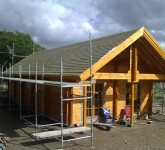 Delivery and construction of log house with planning permission for wind turbine