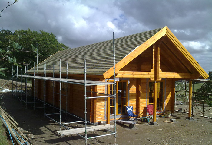  construction of log house with planning permission for wind turbine